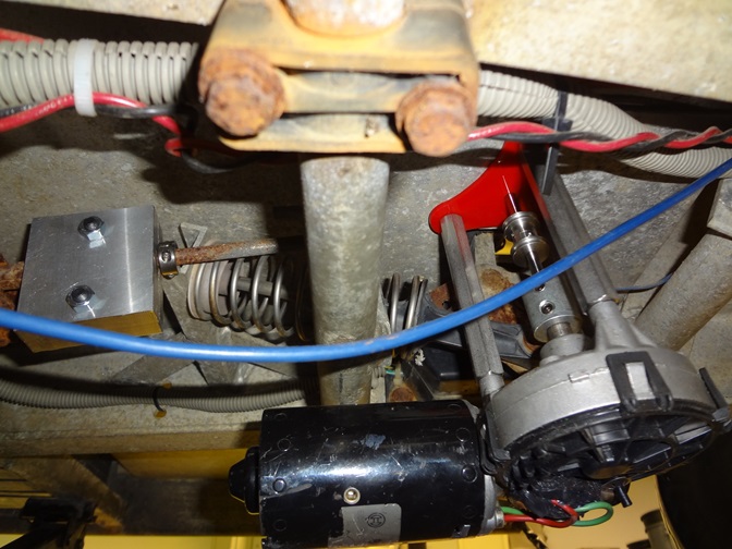 The braking system mounted underneath the golf cart's floor.